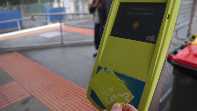 Photograph of someone touching on their Myki, which homeless Victorians can avoid with the free public transport trial.