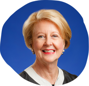 Portrait photo of Justice Connect patron Gillian Triggs smiling and facing the camera